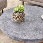Table basse ronde de 80 cm avec plateau aspect pierre grise et pieds croisés