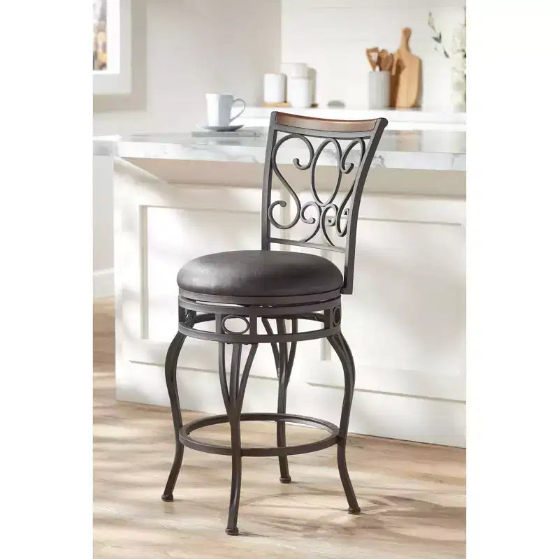 Tabouret de comptoir pivotant en bronze avec siège en similicuir et dossier en volutes